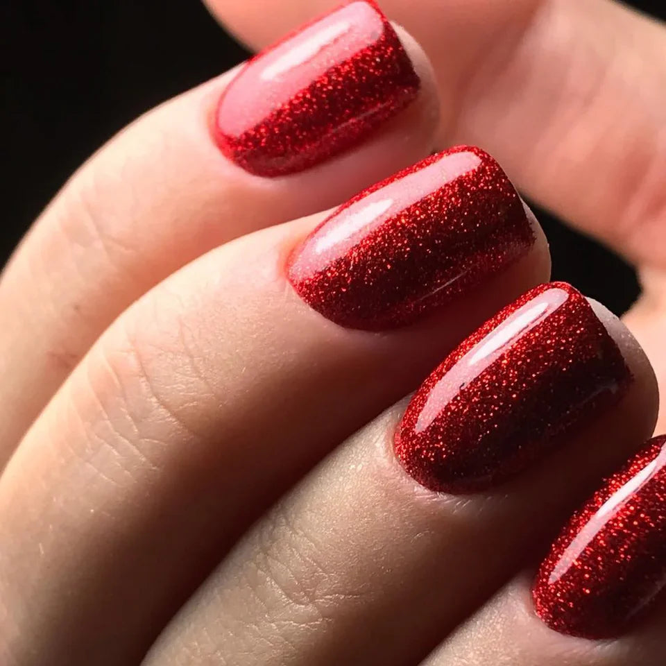 Luxio Soak-Off Gel Polish Garnet with glitter, 15ml, featuring rich red glittery finish on a gel nail.