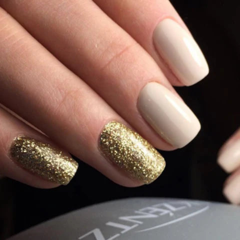 Luxio Soak-Off Gel Polish in Gold Glitter, 15ml bottle, with shimmering gold and glitter finish for manicures and nail art.
