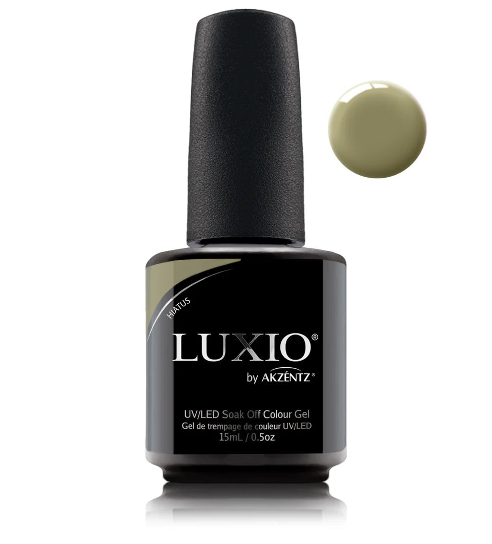 Luxio soak-off gel polish in Hiatus 15ml bottle, showcasing the vibrant nail color and glossy finish.