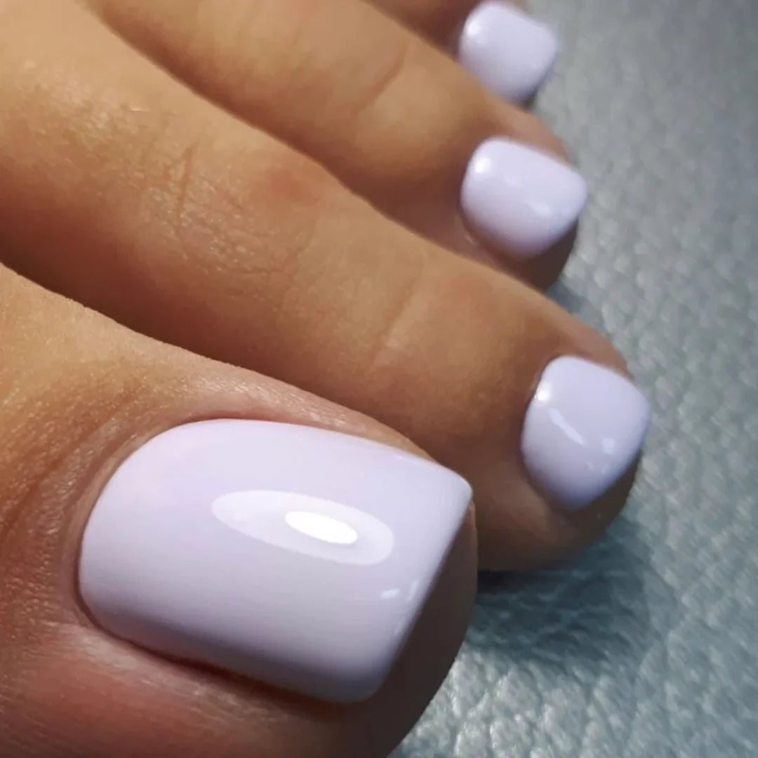 Luxio Soak-Off Gel Polish in Lovely 15ml bottle, showing the smooth, glossy gel with pinkish hue and brand label.