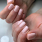 Luxio Soak-Off Gel Polish Lustful 15ml bottle with applicator brush, showcasing vibrant pink gel polish for nails.