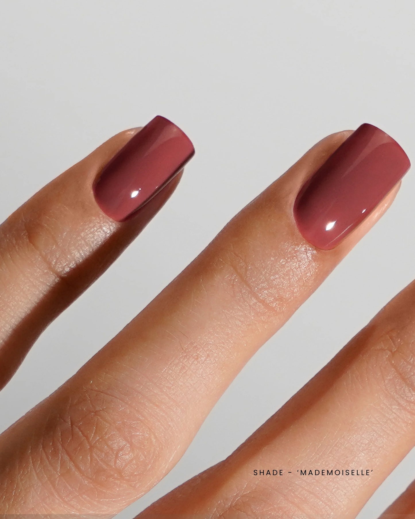 Luxio Soak-Off Gel Polish Mademoiselle 15ml bottle showing the clear glass container with purple gel polish inside.