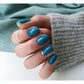 Luxio Soak-Off Gel Polish in Peacock color, 15ml bottle, featuring vibrant teal and blue shades with a glossy finish.