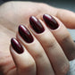 Luxio Soak-Off Gel Polish Potion in shimmer, 15ml, with a sleek bottle and a shimmering finish, perfect for gel manicures.
