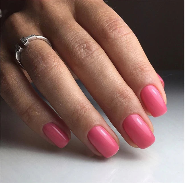Luxio Soak-Off Gel Polish in Pout shade, 15ml, showing the sleek bottle with vibrant nail polish color inside.