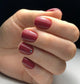 Luxio Soak-Off Gel Polish in Rebel shade, 15ml bottle, with vibrant dark red color and branded packaging.