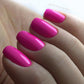 Luxio Soak-Off Gel Polish in Sassy 15ml bottle, showcasing vibrant pink color and sleek packaging.