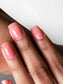 Luxio Soleil Soak-Off Gel Polish on a model's nails, showcasing the vibrant color and glossy finish of Luxio gel polish.
