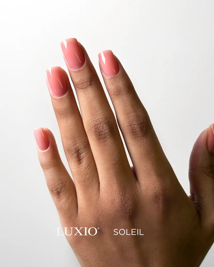 Luxio Soleil soak-off gel polish in 15ml bottle, vibrant yellow color, with a smooth gel texture for professional manicures.