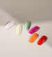 Luxio Luxio Soak-Off Gel Polish Sunny 15ml with chips from the collection, showcasing vibrant yellow nail color and glossy finish.