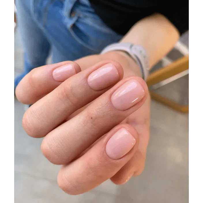 Luxio gel polish bottle labeled Luxio Soak-Off Gel Polish Timid Sheer 15ml, with a clear, light pink tint and branding visible.