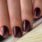 Luxio soak-off gel polish Vamp 15ml bottle with black cap, showcasing deep, rich burgundy color in a clear glass container.