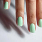 Luxio Luxio Soak-Off Gel Polish Wink 15ml bottle with pink gel polish for nails, displayed in a professional salon setting