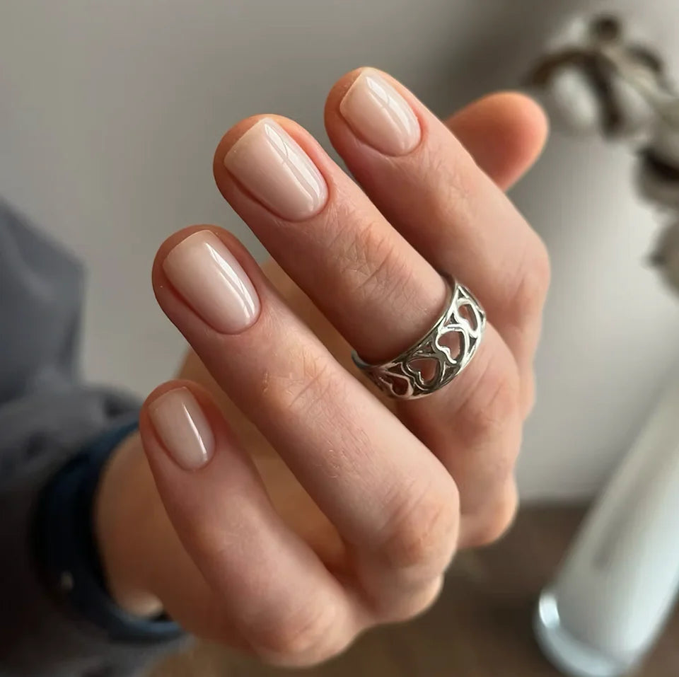 Luxio UV/LED Soak Off Build Almond nail polish in 15ml bottle, showcasing the elegant almond-shaped nails with a glossy finish.