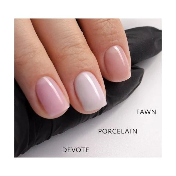 Luxio UV/LED Soak Off Build Porcelain nail gel in tinted Fawn color, 15ml, shown in a professional salon setting