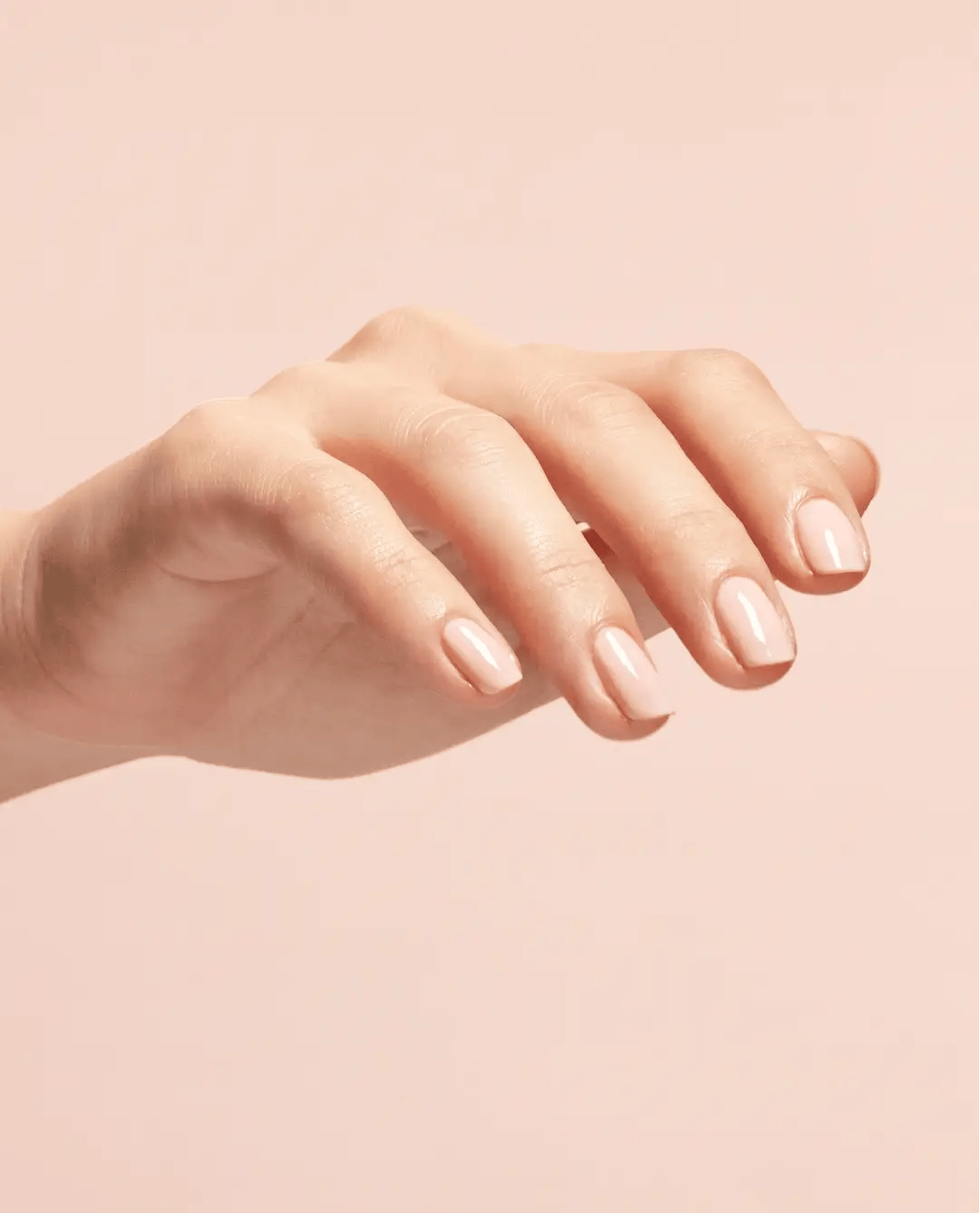 OPI 3-in-1 Start to Finish base coat, top coat, and strengthener in a clear, glossy bottle with a brush applicator.