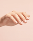 OPI 3-in-1 Start to Finish base coat, top coat, and strengthener in a clear, glossy bottle with a brush applicator.