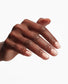 OPI 3-in-1 Start To Finish base coat, top coat, and strengthener applied on manicured nails in a close-up image.