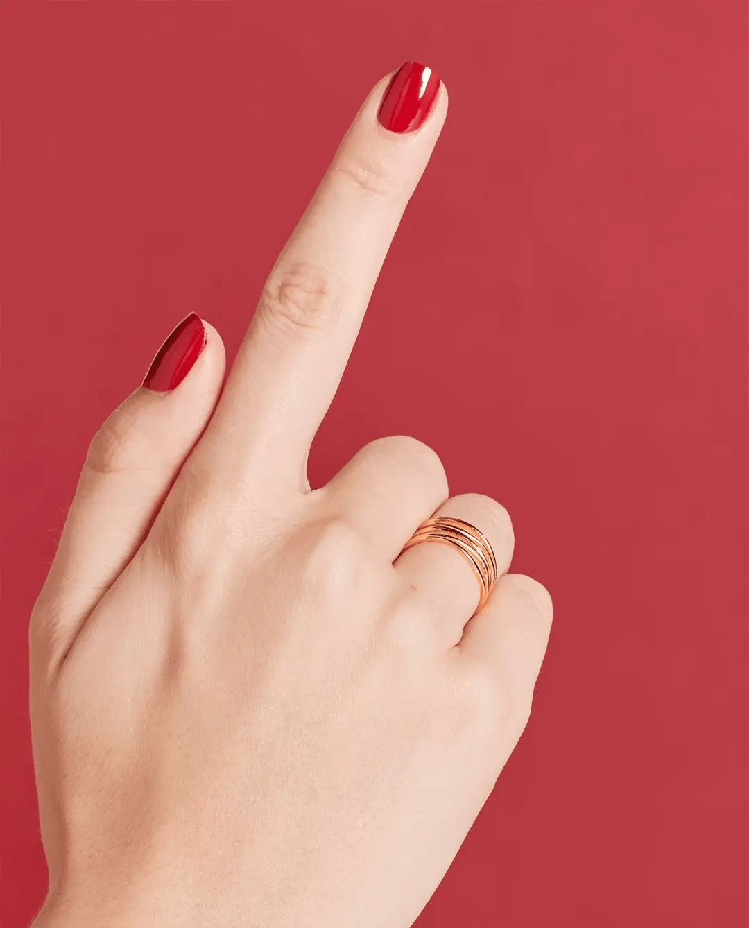 Close-up of OPI Nail Polish bottle in shade Popular Vote #W63, showcasing the vibrant nail polish color and brand label.