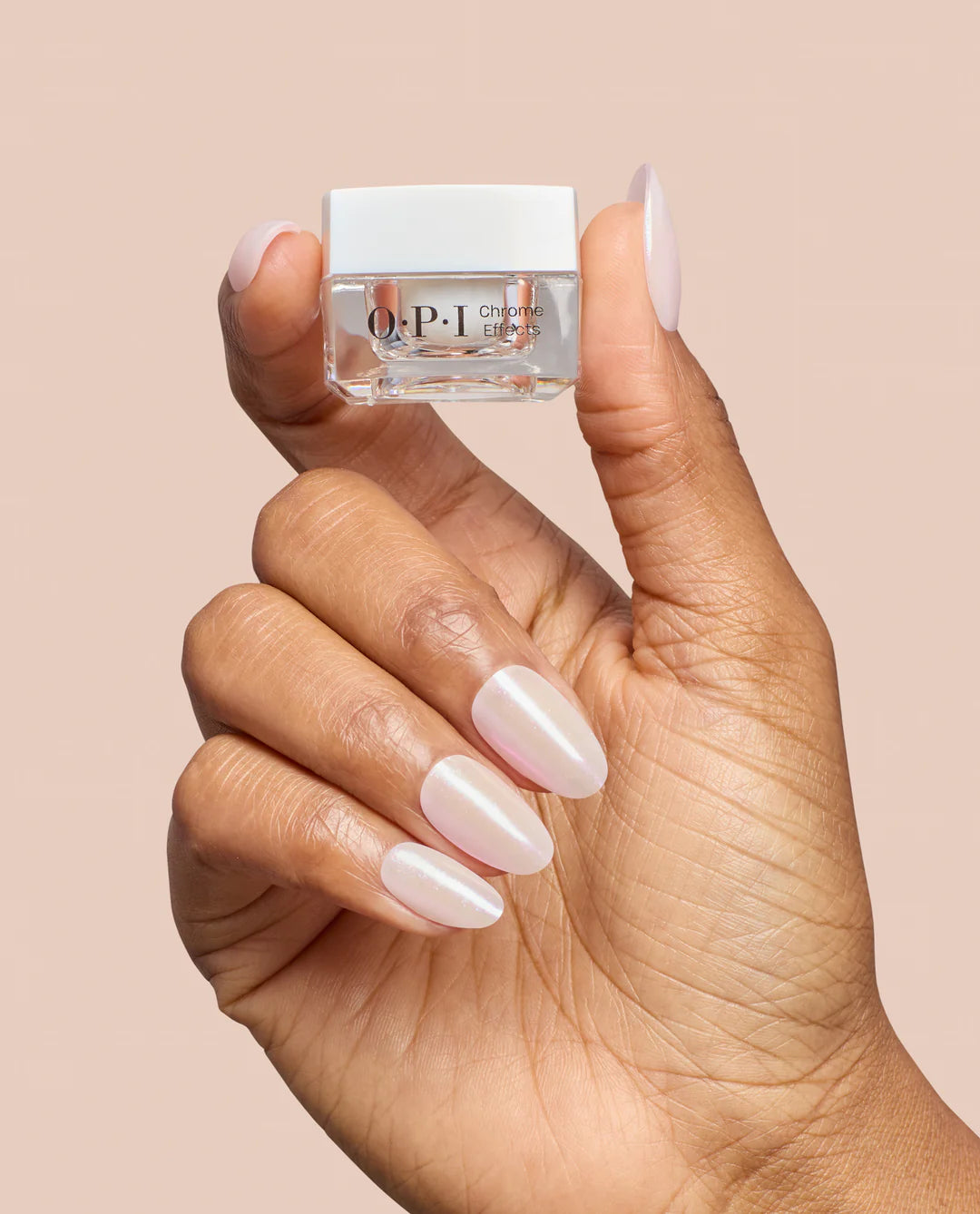 OPI Chrome Powder Pearl Pressure nail color in 0.3 oz bottle, showing shiny pearl finish on a hand with the product bottle.