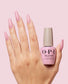 Opi GELevate Builder Gel in 4Get Me Not shade, light hand with bottle, showcasing the nail gel product from Universal Nail Supplies