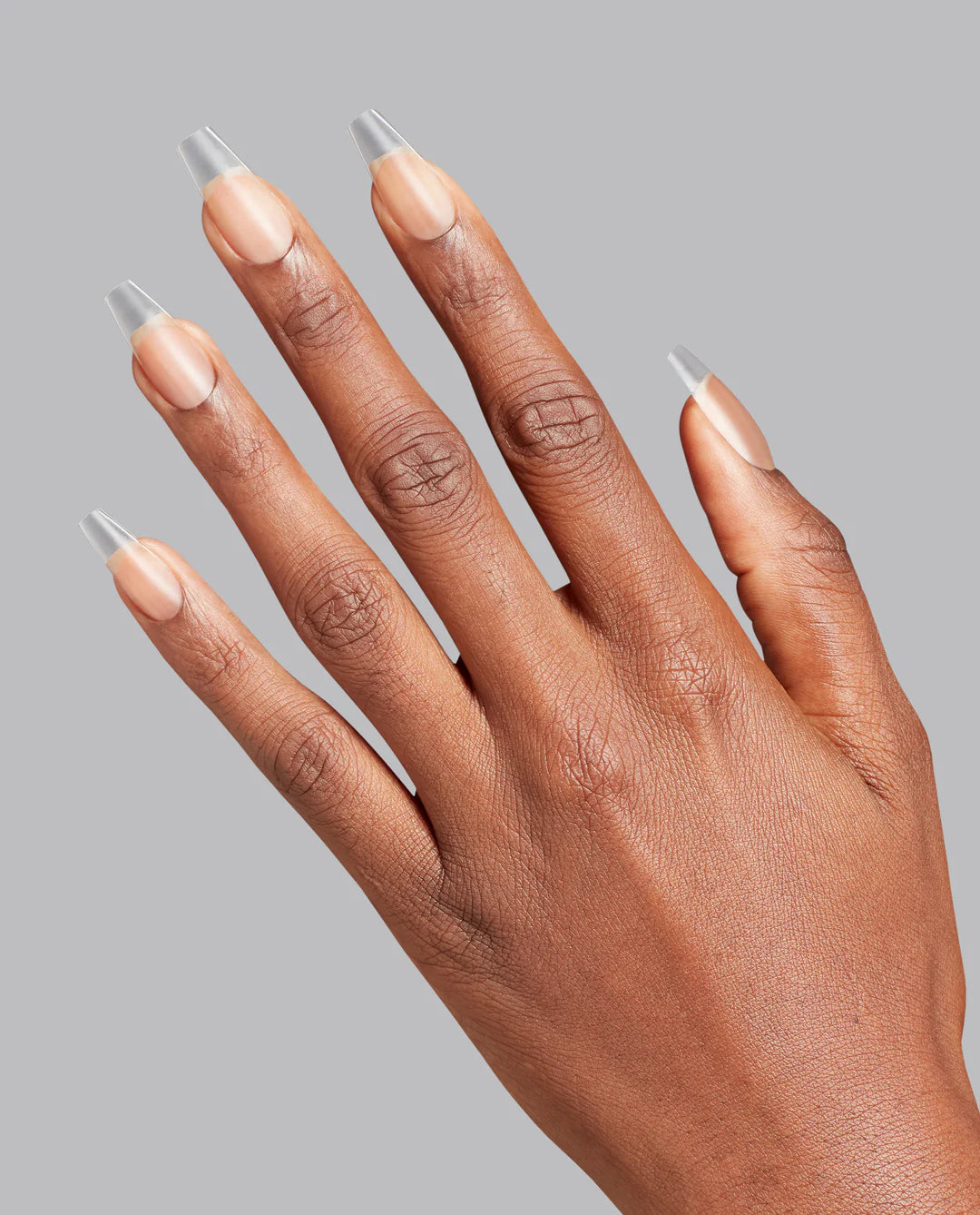 Clear medium coffin-shaped Opi GELevate Soft Gel Tips for full-coverage nail enhancements, ready for prep-free application.