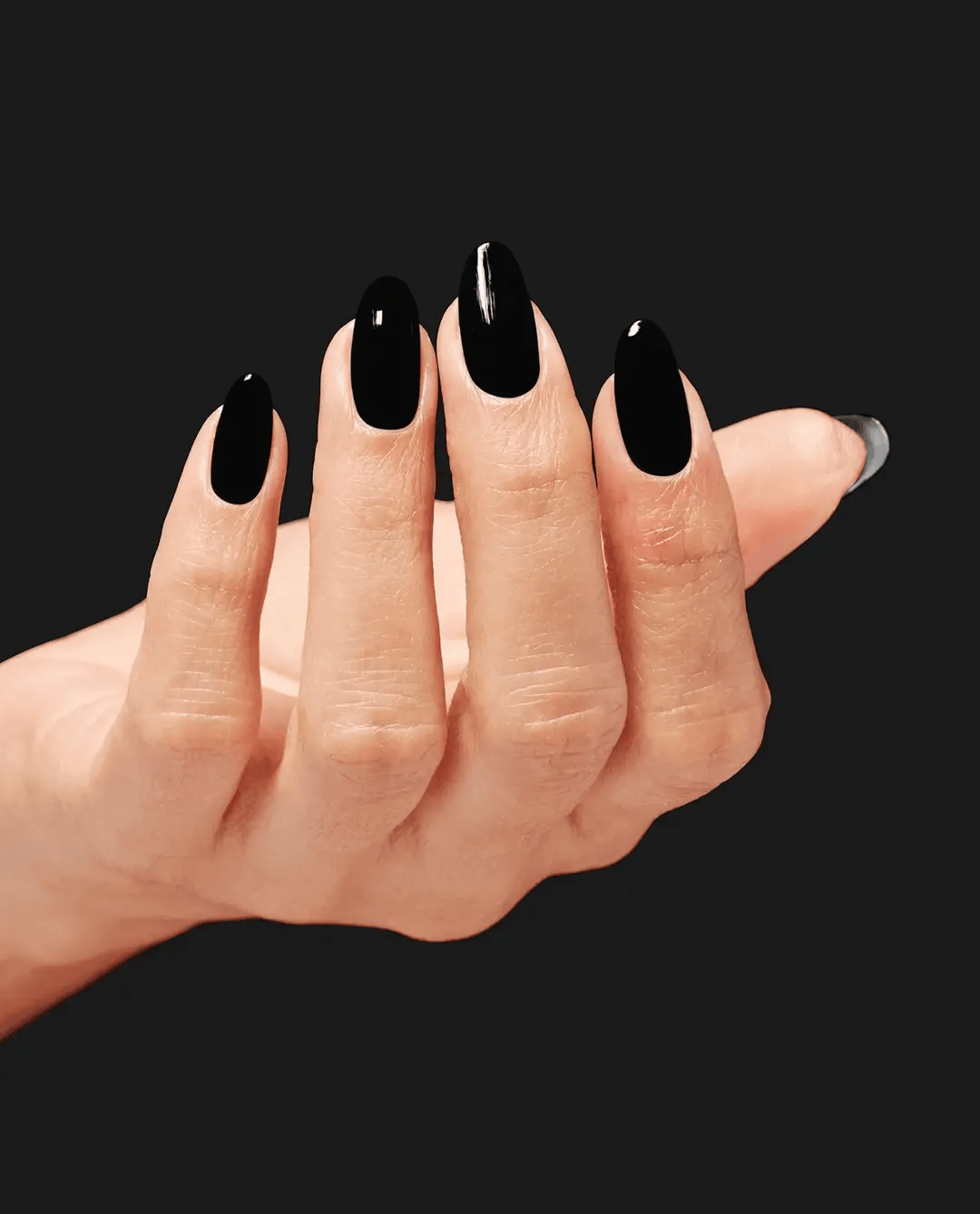 OPI Infinite Shine Black Onyx nail polish bottle with black cap, showcasing sleek black color and glossy finish.