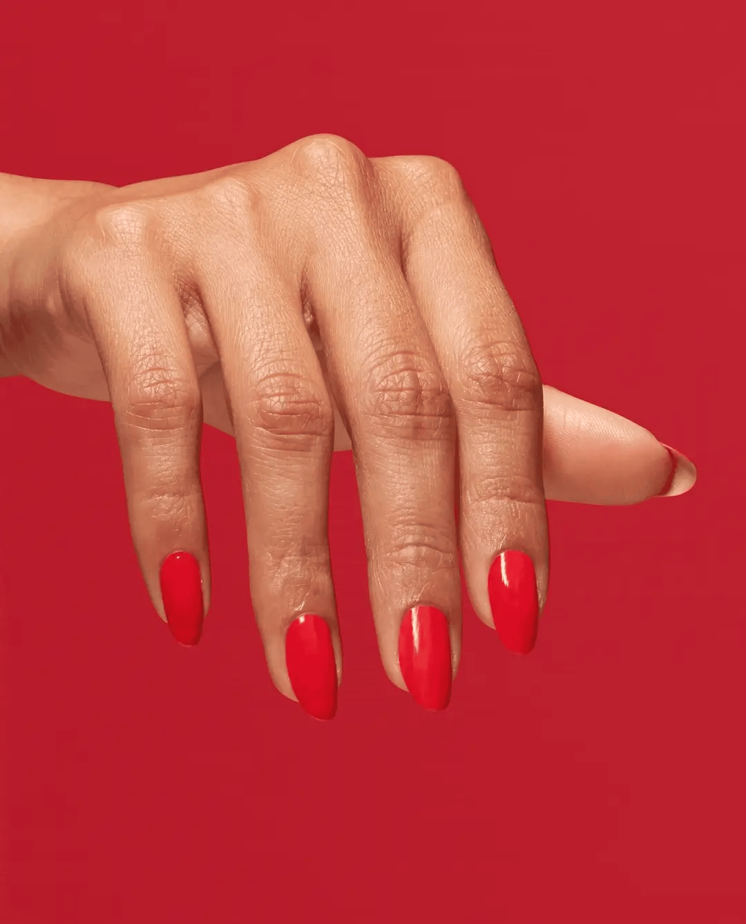 OPI Infinite Shine Cajun Shrimp nail polish bottle with vibrant coral-orange color in a sleek glass container.