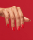 OPI Infinite Shine Cajun Shrimp nail polish bottle with vibrant coral-orange color in a sleek glass container.