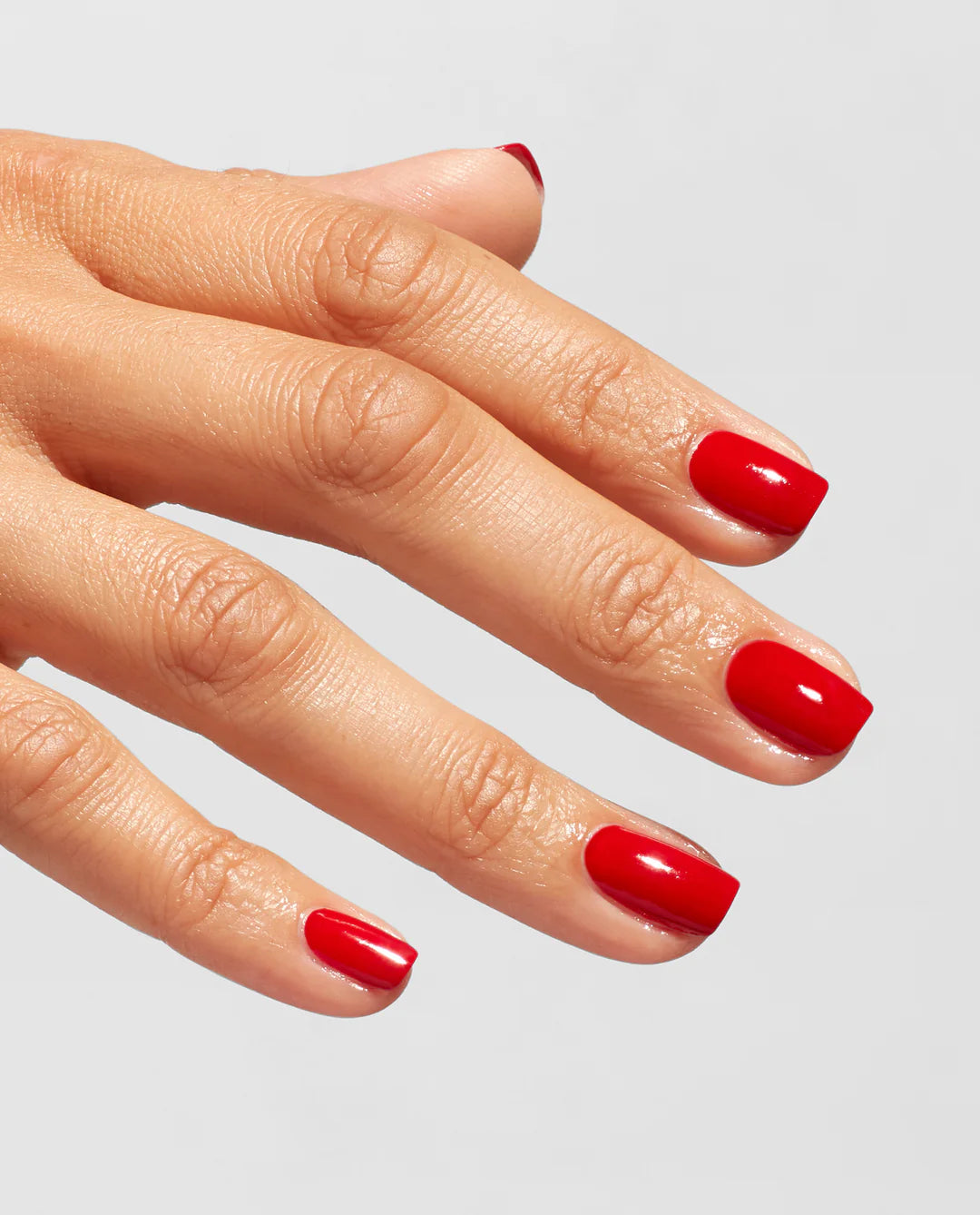 OPI Infinite Shine Gloss Top Coat applied on a manicured nail with a shiny, smooth finish in a professional nail polish image.