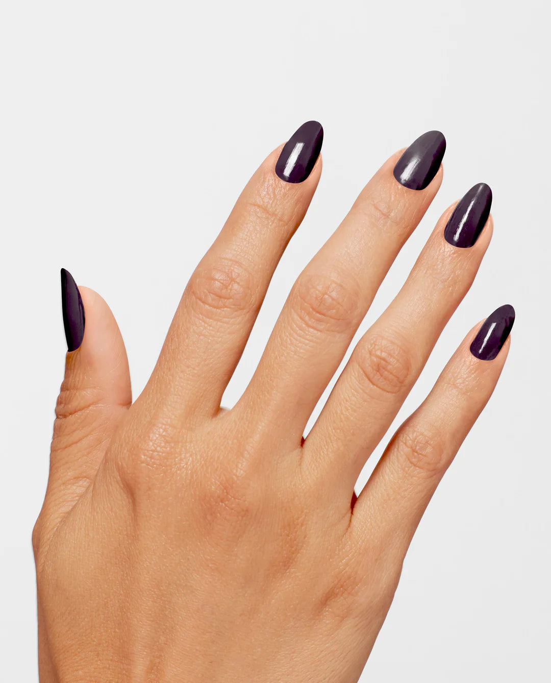 OPI Infinite Shine Lincoln Park After Dark nail polish bottle with dark purple polish on a white background.