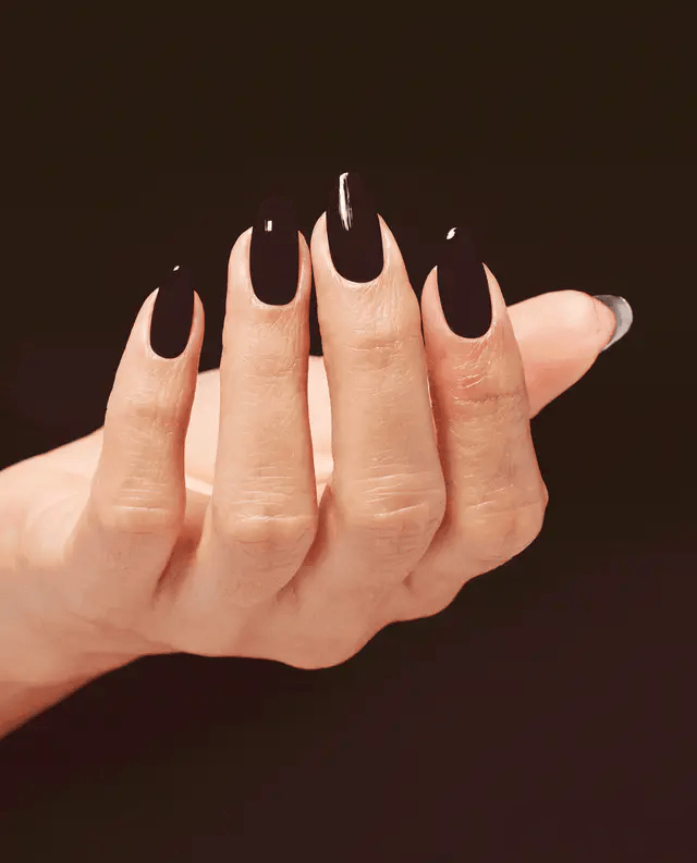 OPI Infinite Shine Not Afraid of the Dark ISL104 dark nail polish bottle with black cap and label, glossy finish, and vibrant color.