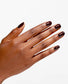 OPI Infinite Shine Not Afraid of the Dark nail polish on nails with a dark, glossy finish, showcasing the deep, rich color.