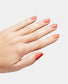 OPI Infinite Shine nail polish in On a Mission shade, glossy finish, bottle with brush visible, showcasing vibrant color.