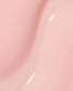 OPI Infinite Shine Passion nail polish swatch showing vibrant pink color on a nail tip with a glossy finish.
