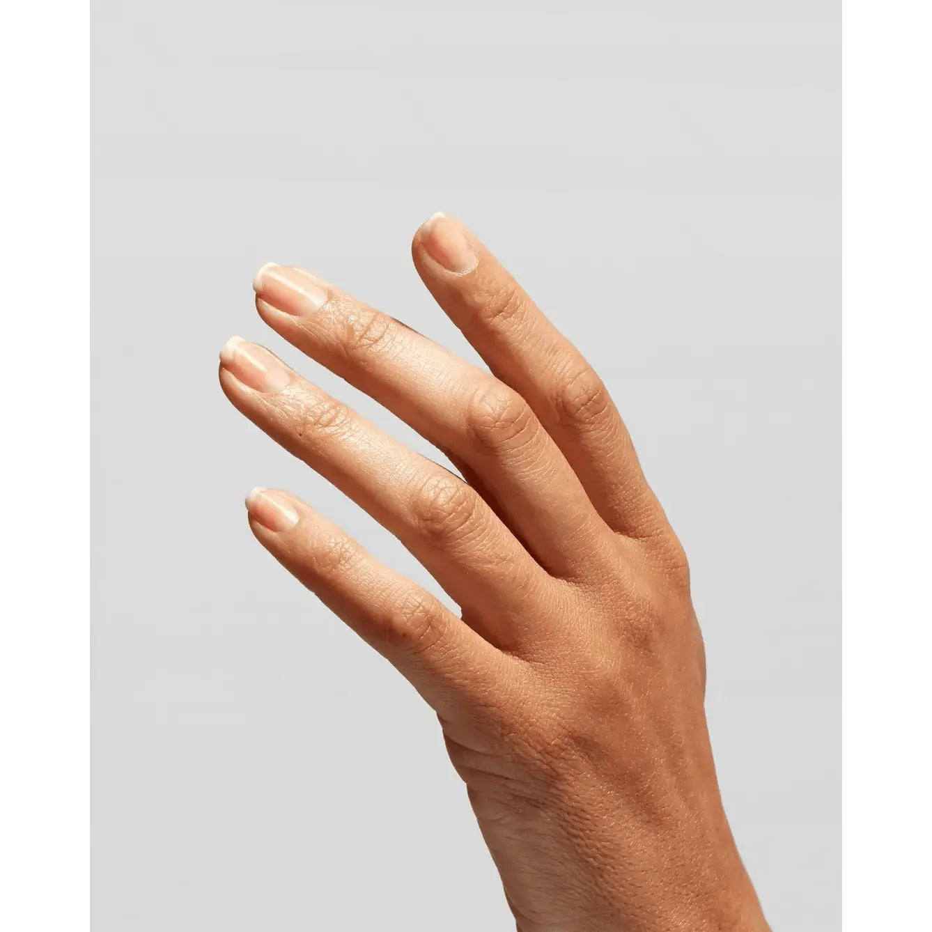 OPI Infinite Shine Primer Base Coat applied on nails, showcasing a smooth, clear layer for long-lasting nail polish application.