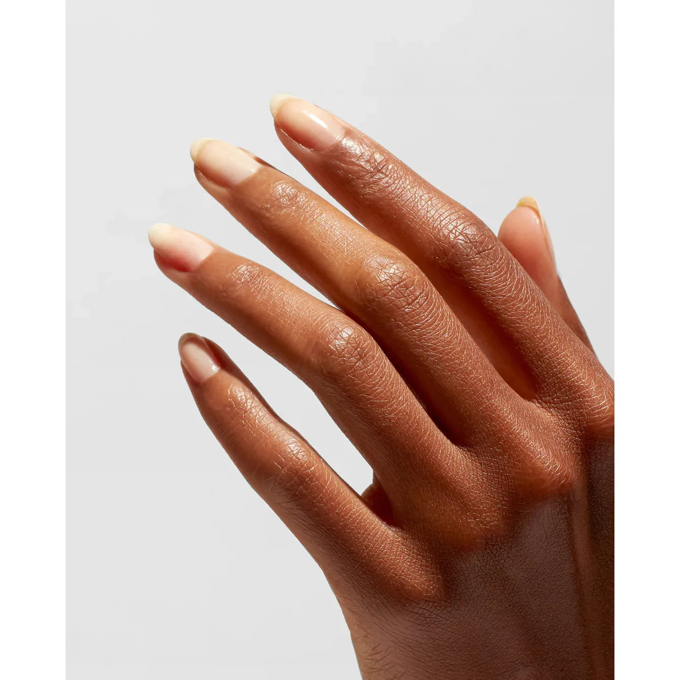 OPI Infinite Shine Primer Base Coat for nails, clear and smooth nail polish base, shown on a manicured hand.