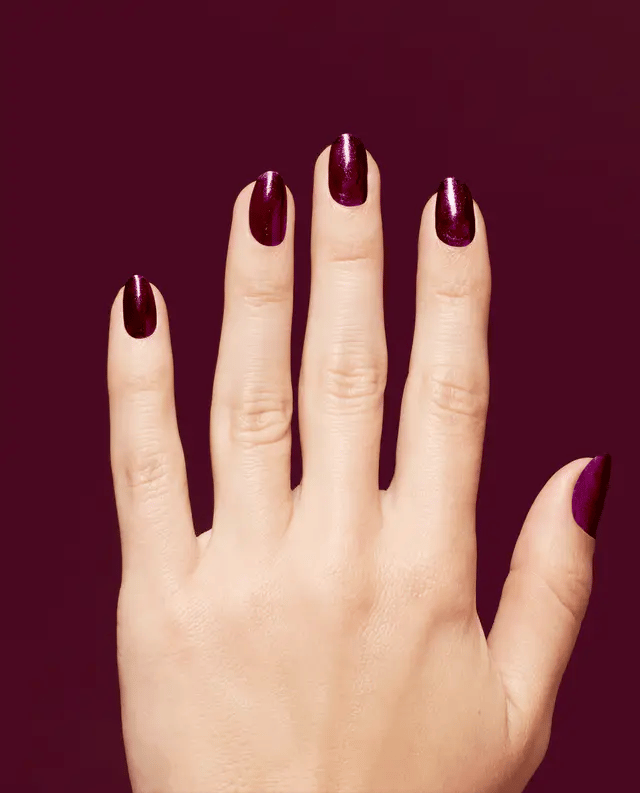 OPI Infinite Shine Vamp Champ nail polish bottle with dark vamp purple liquid and brand logo on the label.