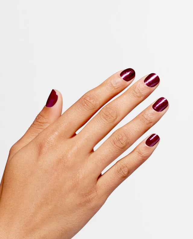 OPI Infinite Shine Vamp Champ nail polish bottle with the dark purple shade, displayed on a neutral background.