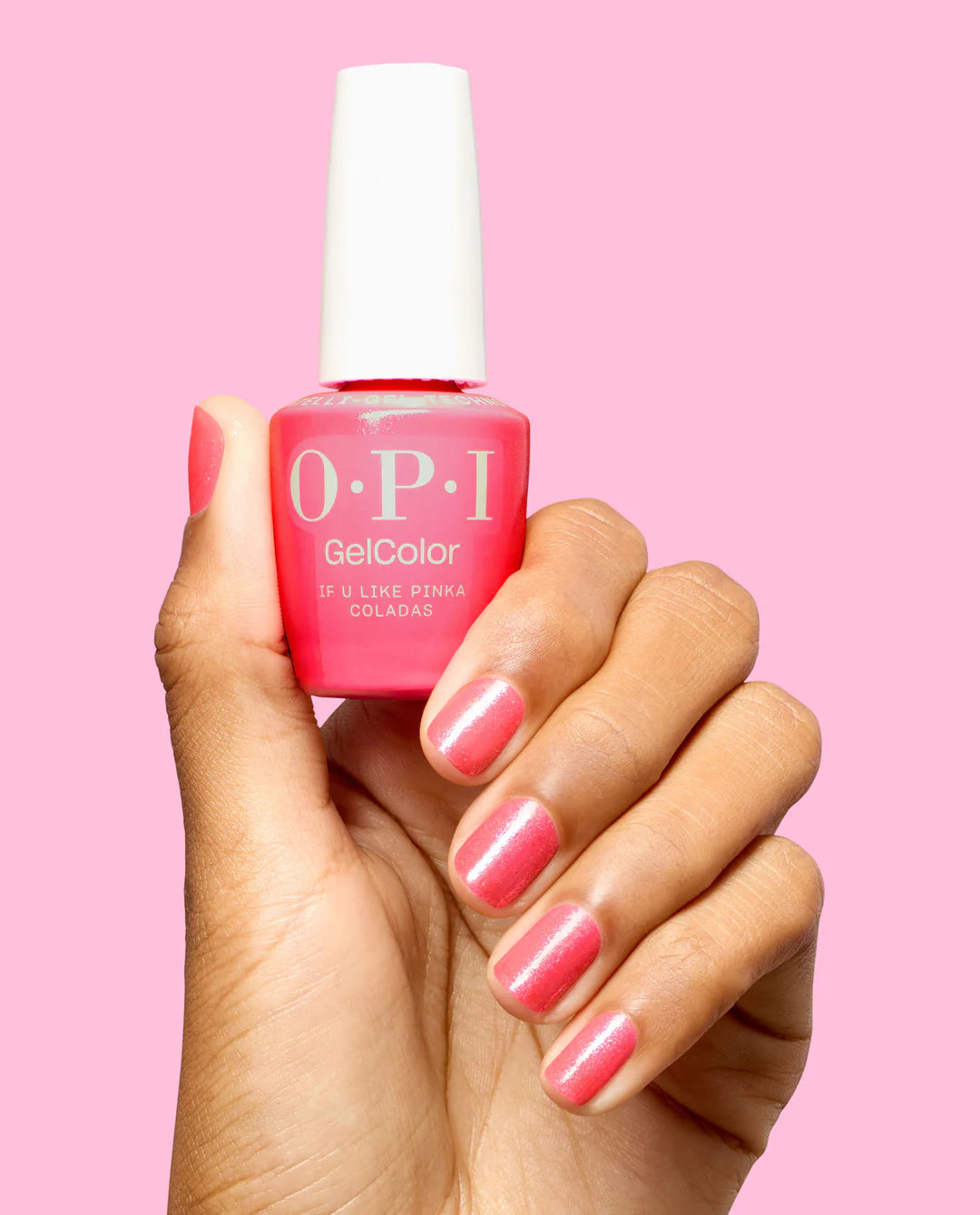 OPI Intelli GelColor nail polish in If U Like Pinka Coladas, pink shade applied on fingers with the bottle visible.