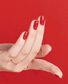 Opi Intelli GelColor Red GCL72 gel nail polish bottle with red color label and branding visible.