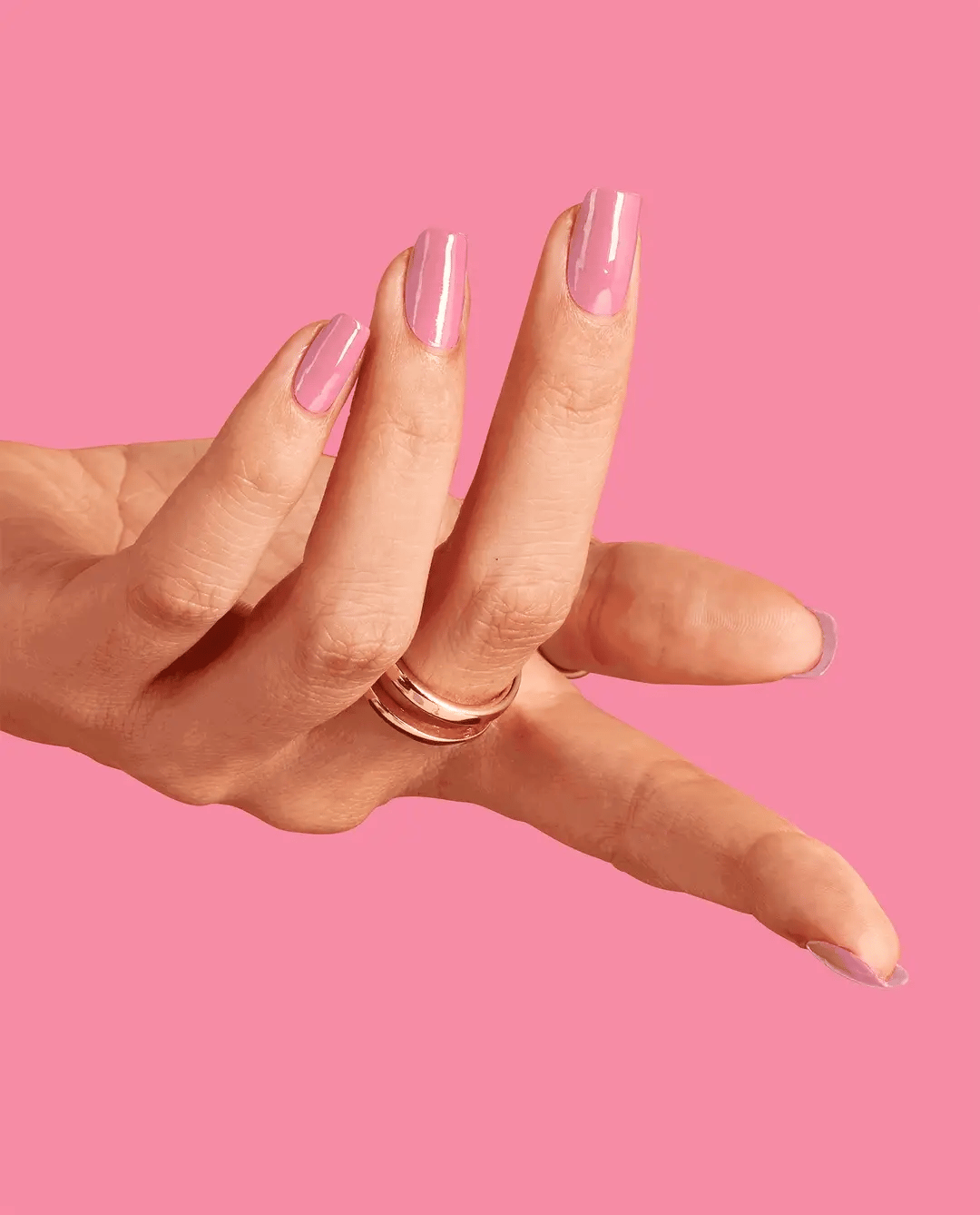 Opi Intelli GelColor Racing for Pinks gel nail polish bottle with pink nail swatches and vibrant pink background.
