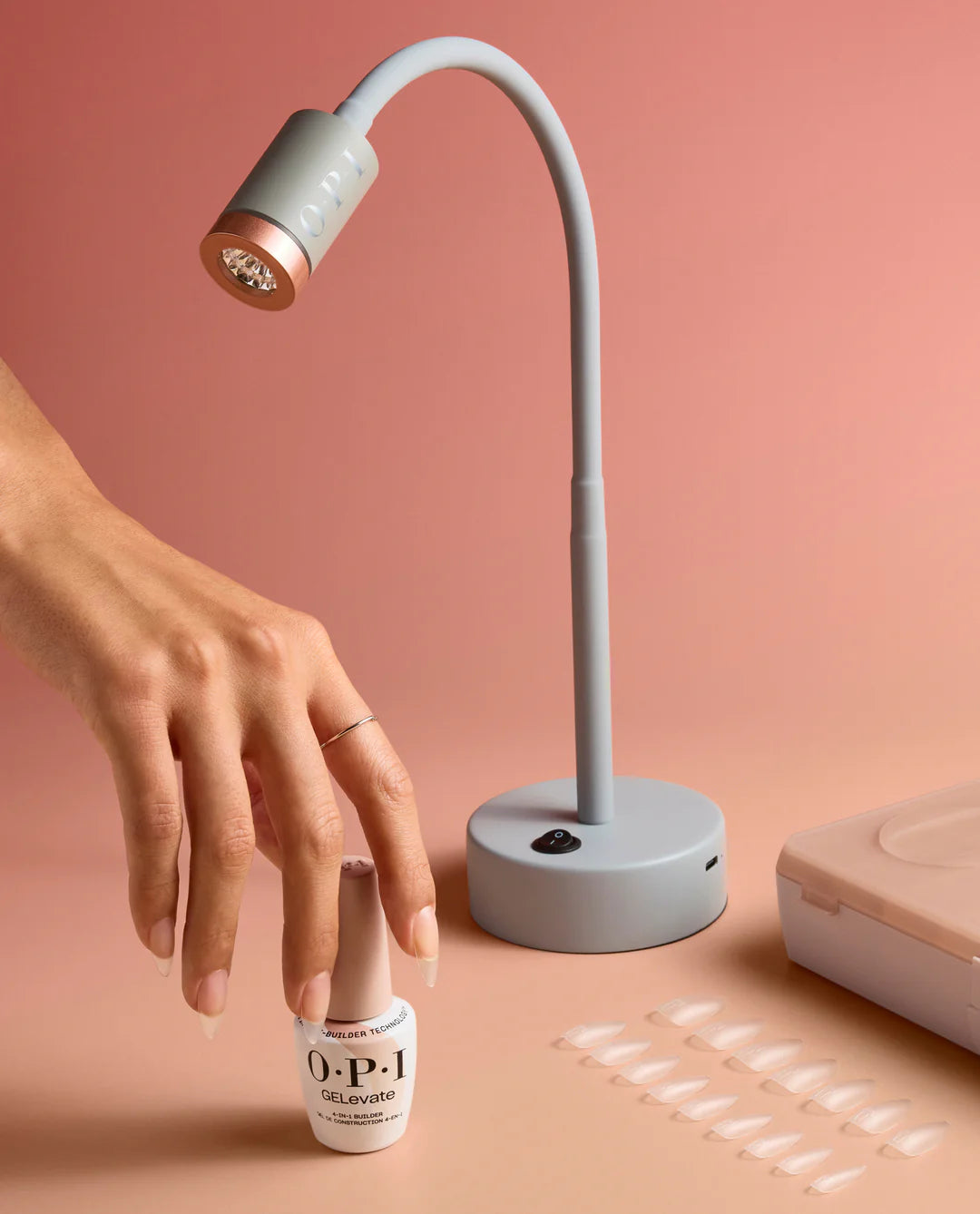 Opi Lightning Flash Cure Gel Lamp by Opi GELevate for curing gel nails, shown with sleek black design and multiple light settings.