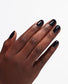 OPI Mirror Shine Top Coat bottle from OPI Nail Treatments, with a glossy, reflective finish visible on a manicured nail.