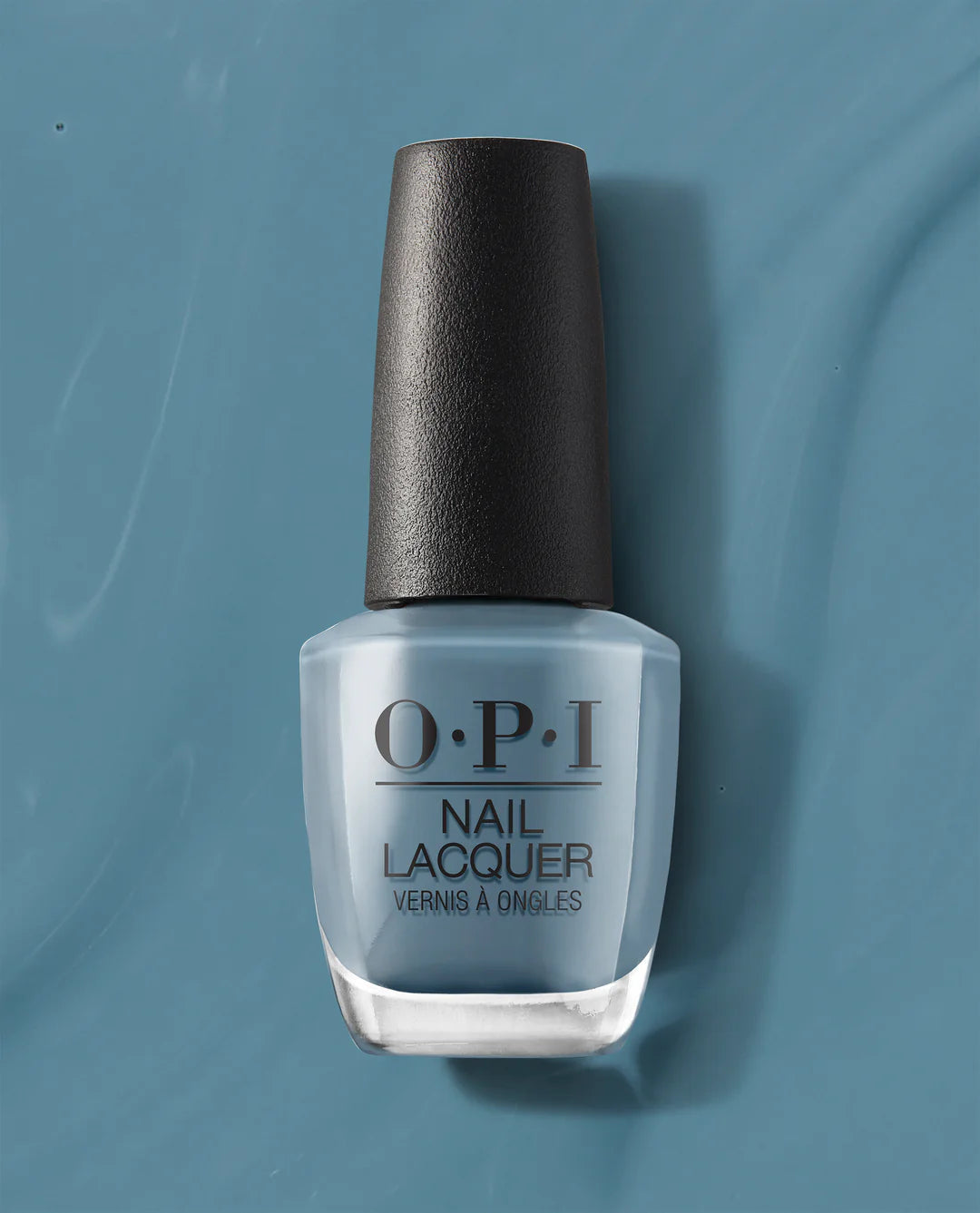 OPI Nail Polish Alpaca My Bags NLP33 in a soft, neutral beige color, displayed in a bottle with a black cap.