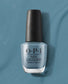 OPI Nail Polish Alpaca My Bags NLP33 in a soft, neutral beige color, displayed in a bottle with a black cap.