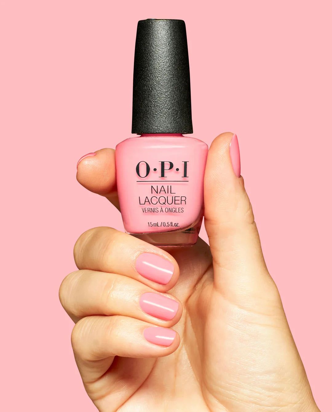OPI Nail Polish Bathtime Bubbly NLS065 bottle and hand with painted nails showing soft pastel blue polish.