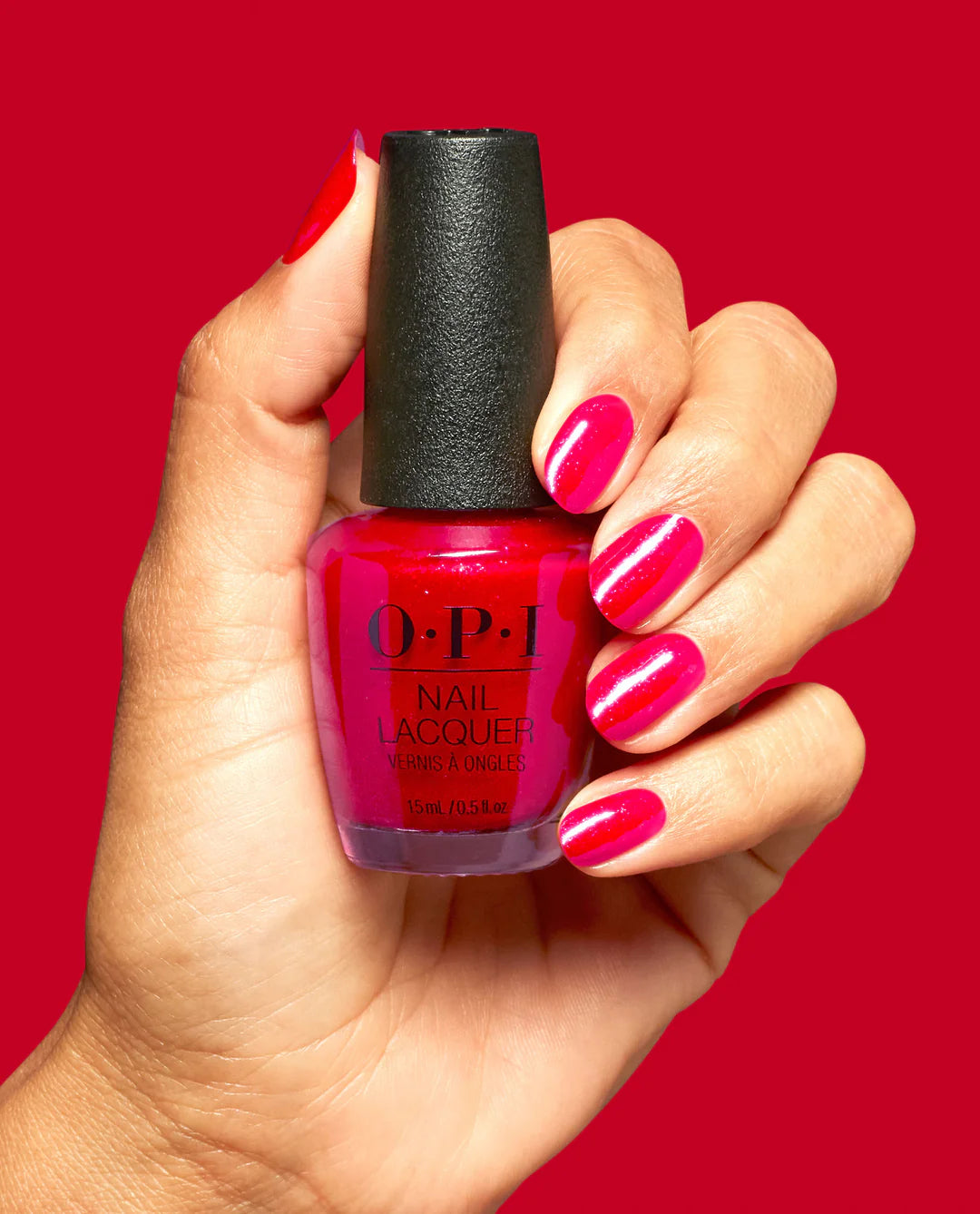 OPI Big Apple Energy nail polish bottle with vibrant pink-colored polish and black cap, showcasing the OPI brand label.