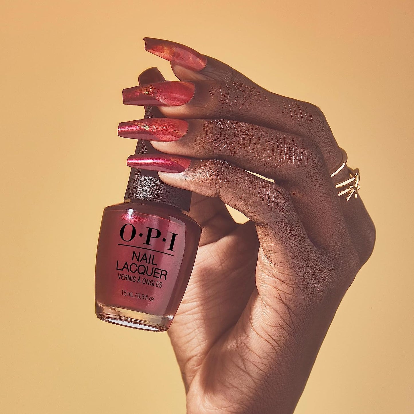 OPI Big Sagittarius Energy nail polish bottle with black cap and label, showcasing vibrant nail polish color.