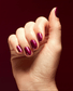 OPI Nail Polish in Big Sagittarius Energy shade, vibrant orange nail polish bottle with the product label visible.
